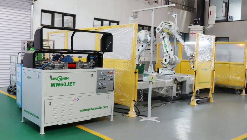 FLOW 60,000 PSI intensifier pump waterjet cutting