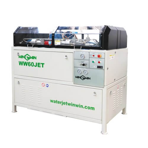 FLOW 60,000 PSI intensifier pump waterjet cutting